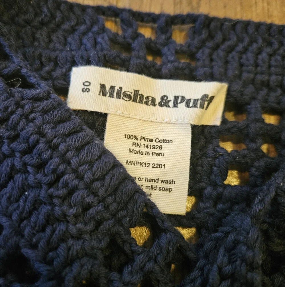 misha and puff black crochet scarf with pom poms